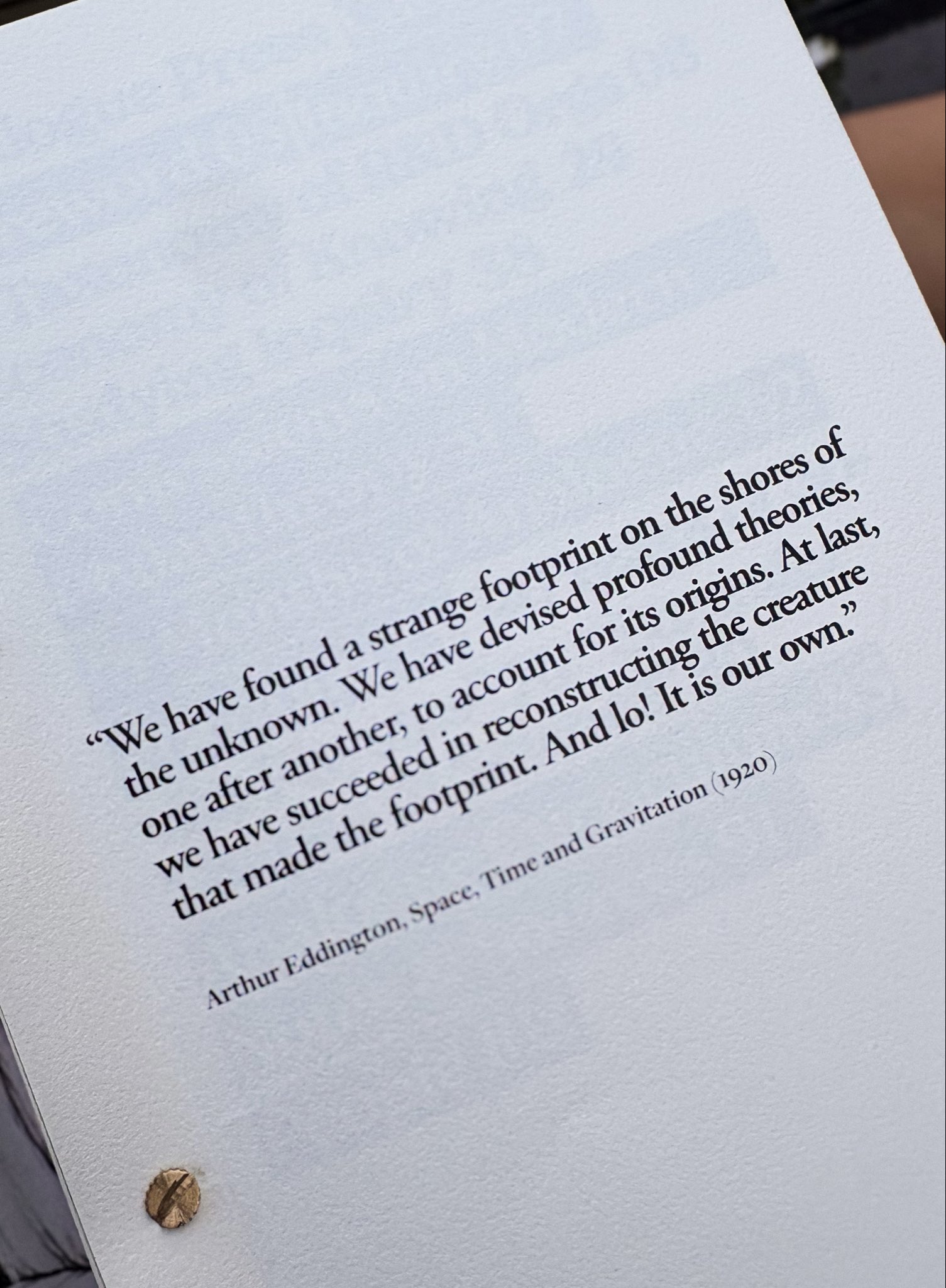 A close-up of a page of catalogue with a quotation by Arthur Eddington